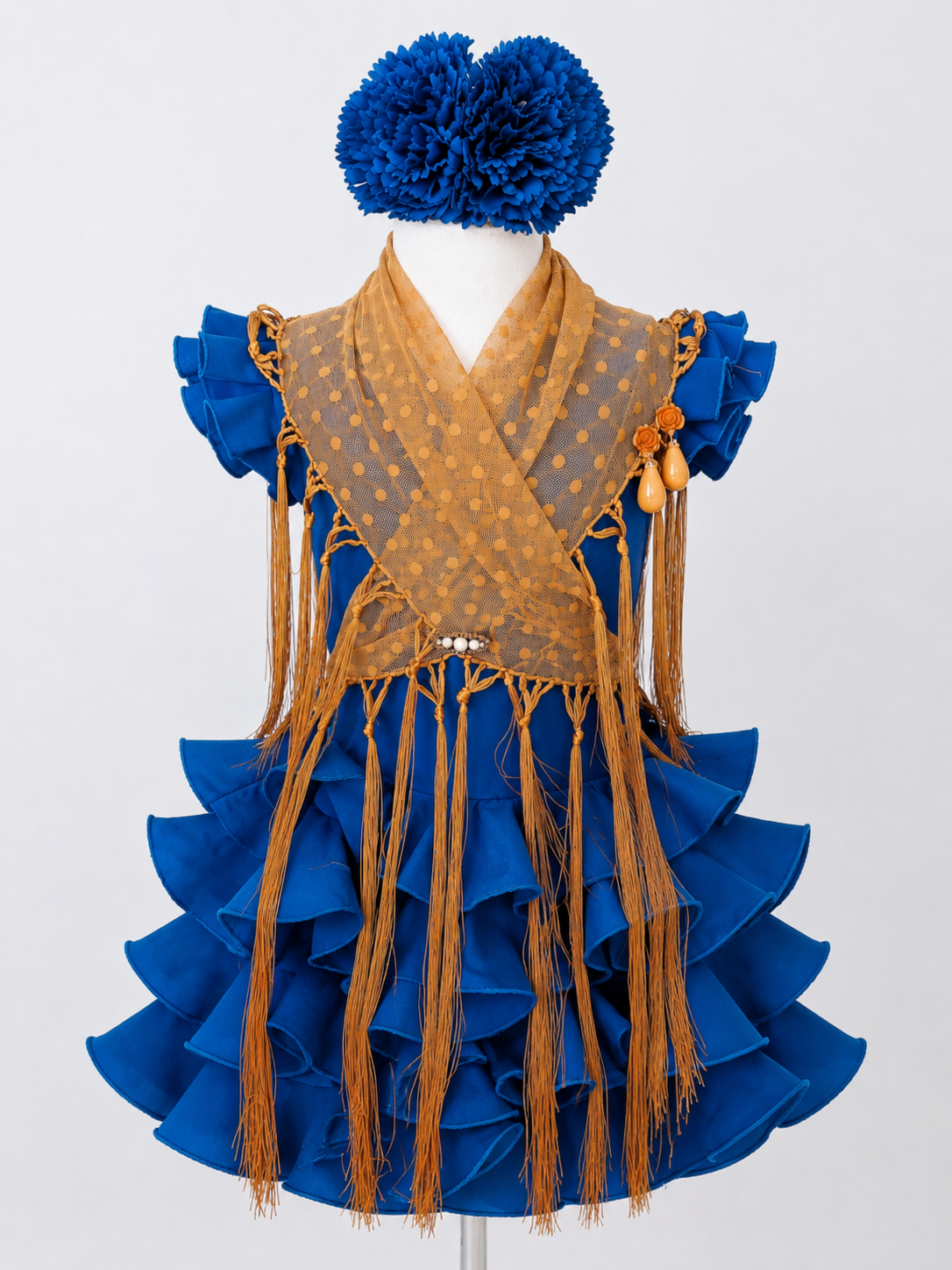 Mantoncillo de flamenca de plumeti en color mostaza para niña, con flecos largos y tejido transparente con lunares MiBebesito